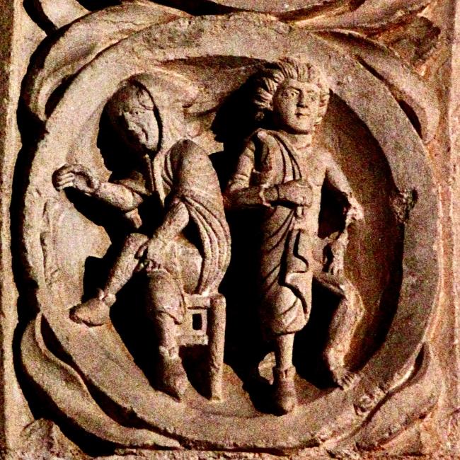 Timpaan - twee mensen bij de haard